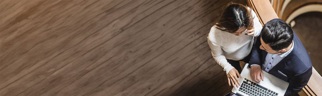 man and woman with laptop